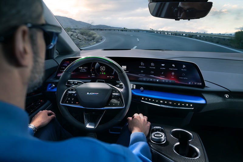 Front View of the 2026 OPTIQ-V Driving Through the Dusk Utilizing its Headlights | Michael Hohl Cadillac in Carson City NV